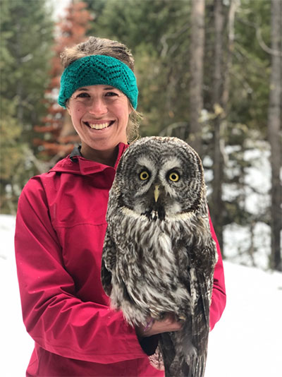 Image of Katherine Gura posing with a Great Gray Owl